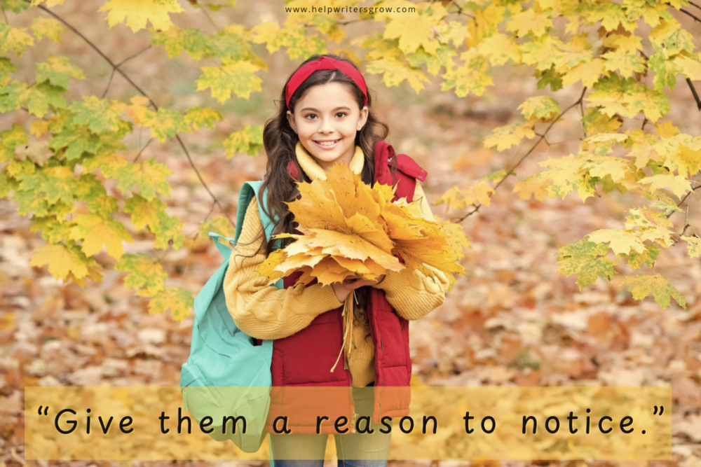 Girl holding an armful of yellow fall leaves while exploring outdoors
